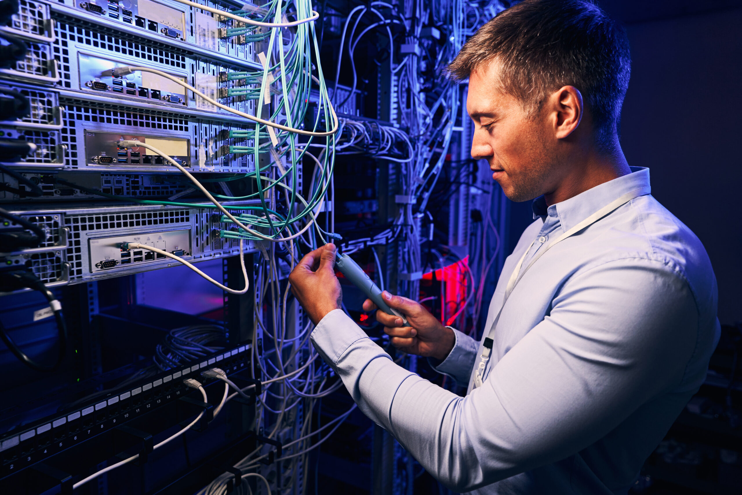 focused data center employee checking cabling infr 2021 10 20 21 27 49 utc scaled
